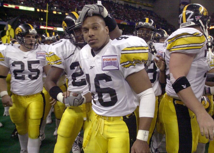 Iowa senior running back Ladell Betts celebrates Iowa's 19-16 win over Texas Tech with teammate Chris Smith at the Alamo Bowl in 2001.
