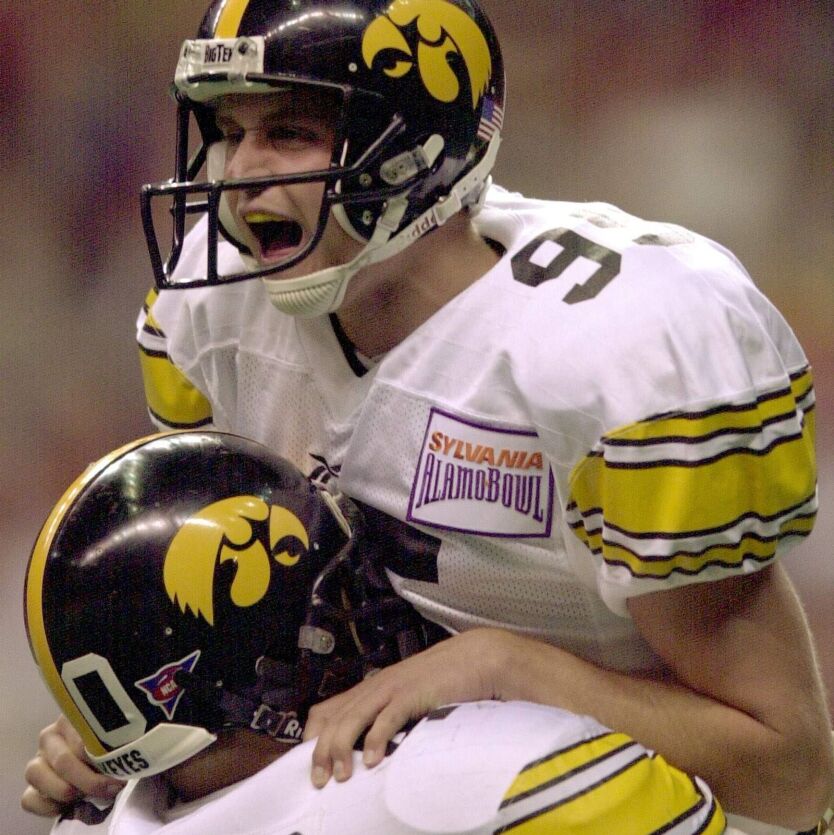 Iowa kicker Nate Kaeding celebrates with teammate Edgar Cervantes after kicking the game-winning field goal against Texas Tech in the Alamo Bowl in 2001.